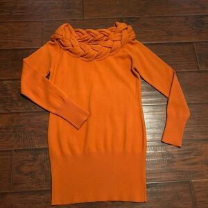 Get Fall Sweaters ready! This unique orange sweater by Questions. Size M.
